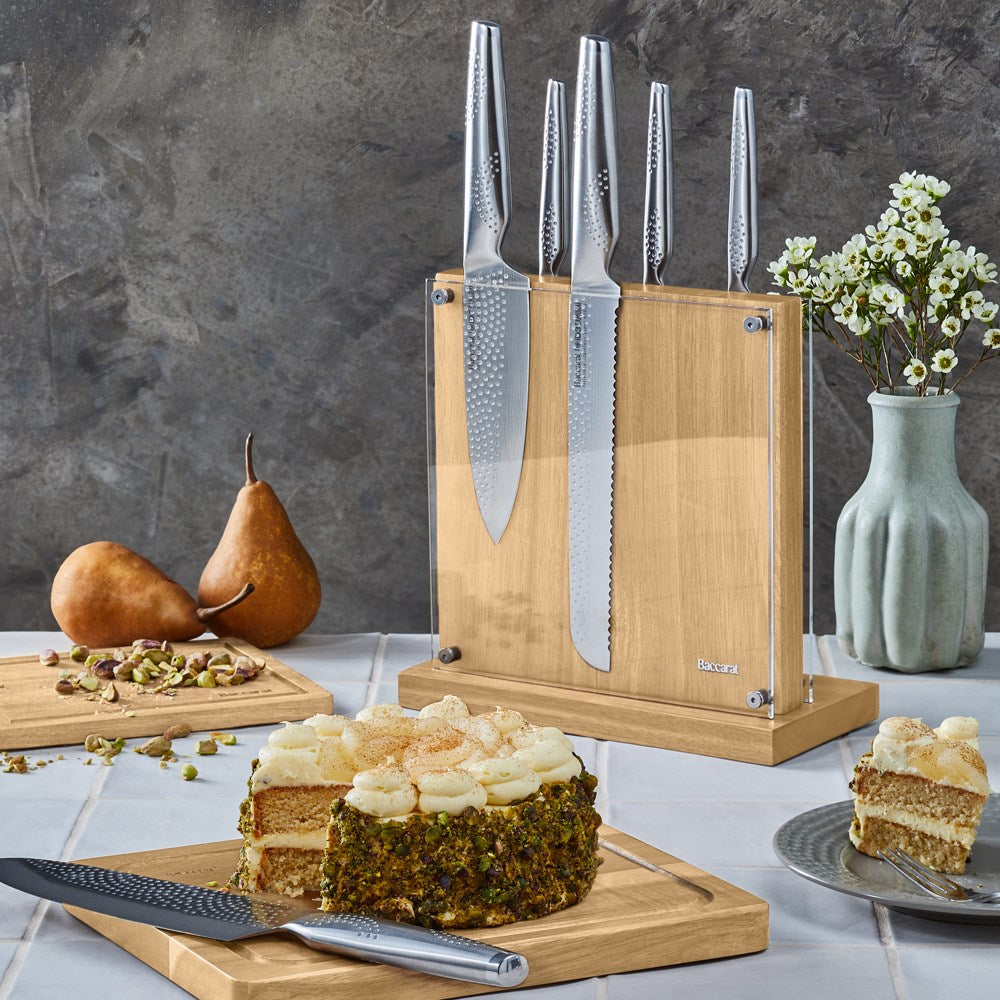 Knife set with silver blades displayed with fruit and nuts on table for precision cutting - Baccarat
