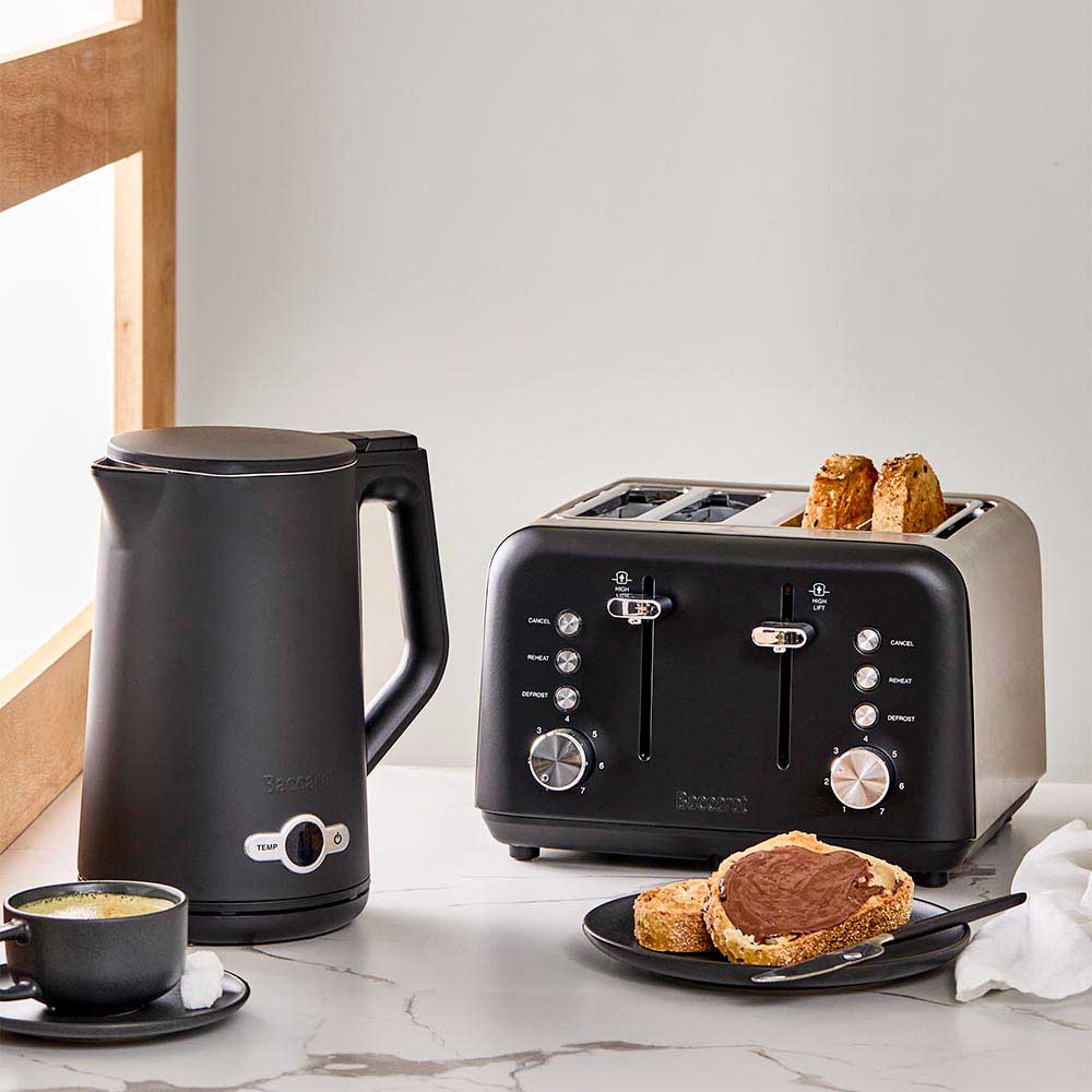 Kitchen counter with toast and a cup black four slice toaster frypan black toast frypan - Baccarat