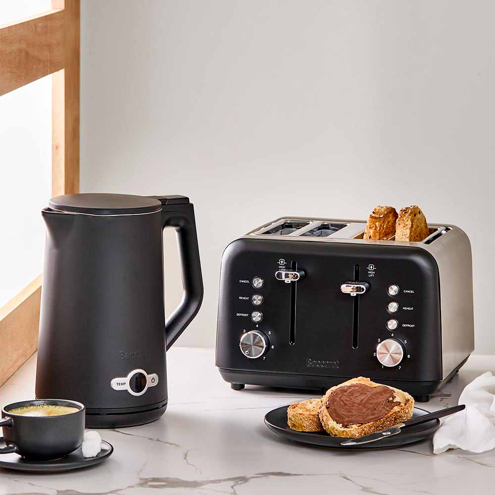 electric kettle on kitchen counter with cup saucer and plate of toast black kettle - Baccarat