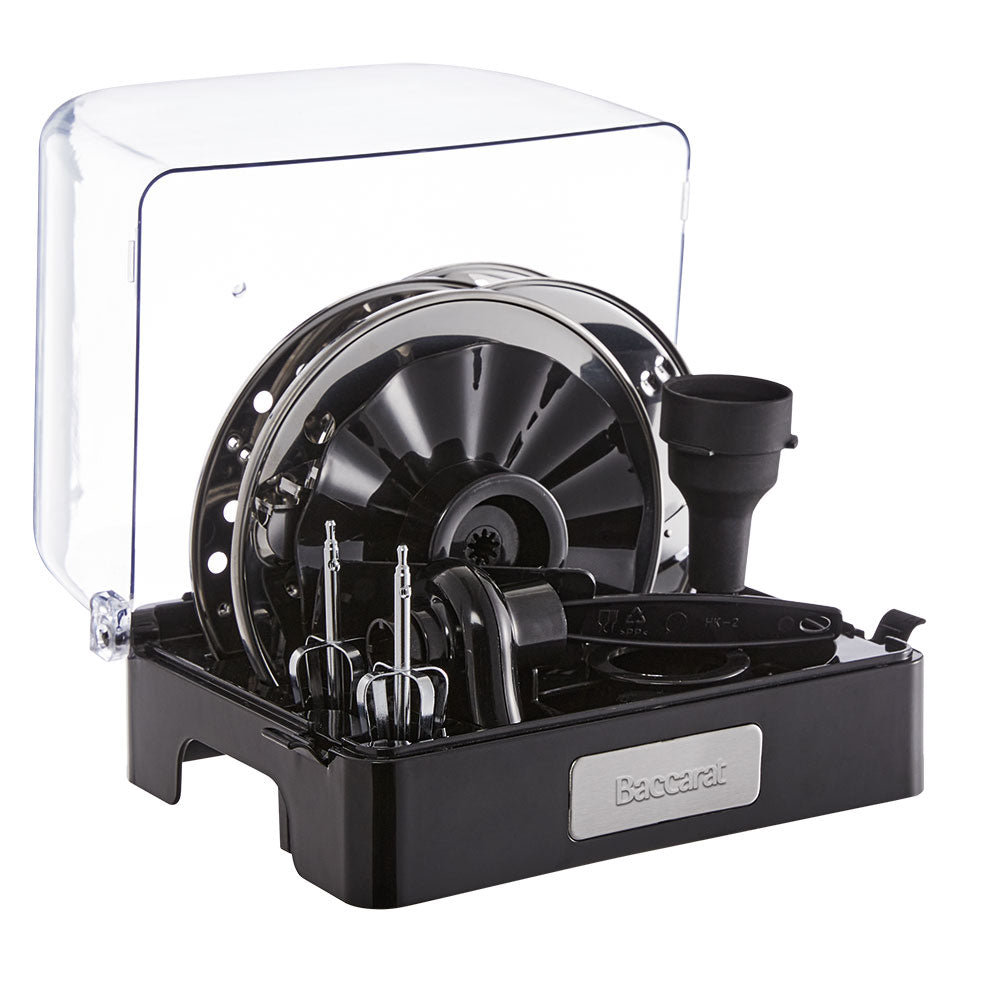 black air fryer with green ingredients on marble counter near dishes and a spice grinder - Baccarat