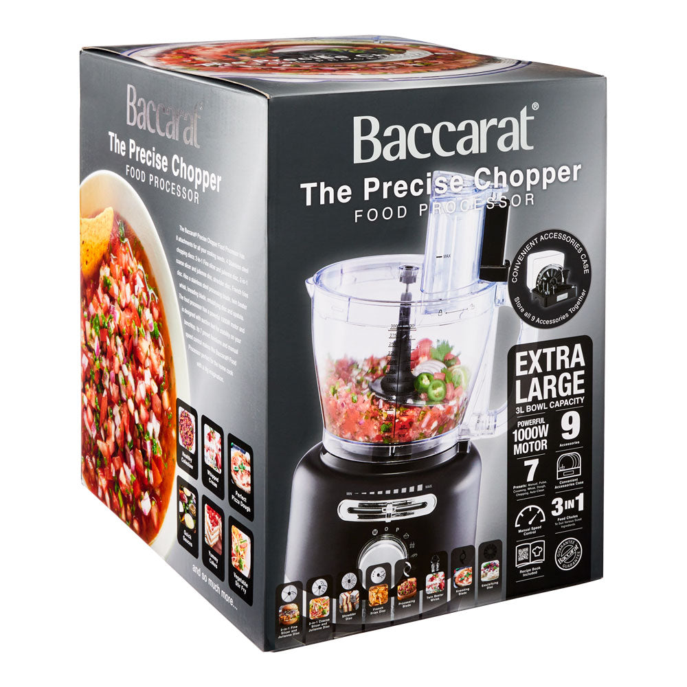 black air fryer with green ingredients on marble counter near dishes and a spice grinder - Baccarat
