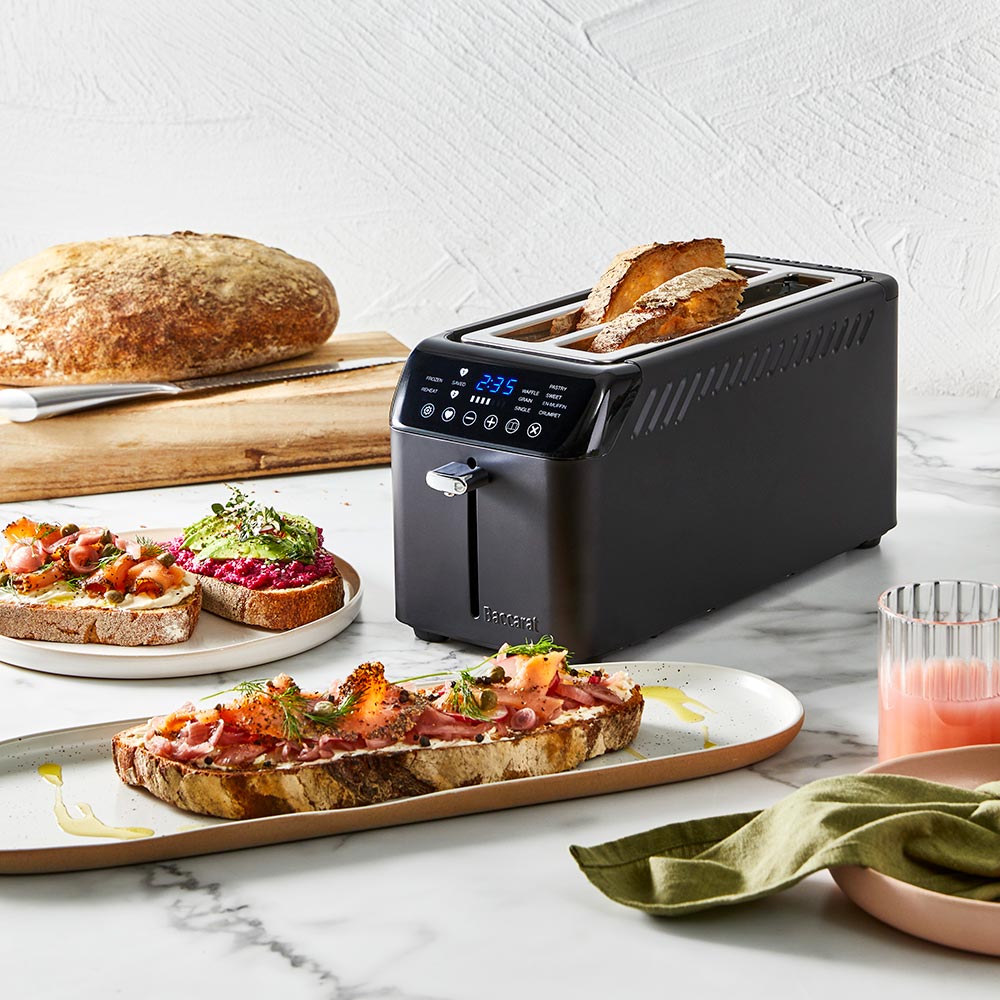 Front view of Baccarat The Artisan Toasty Slice with digital controls and stainless steel accents