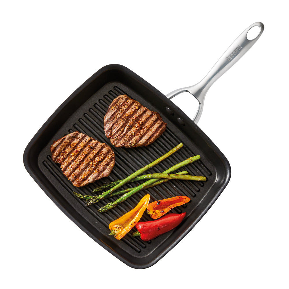 Square grill pan with steaks asparagus and bell peppers black with silver handle - Baccarat