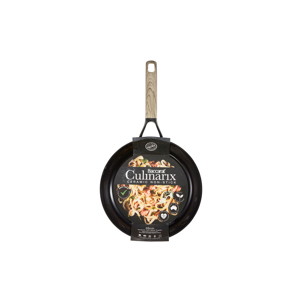 Creamy pasta with herbs on a white plate with parmesan wedge and non stick frypan 20cm - Baccarat