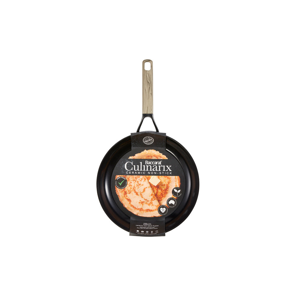 Pancakes in skillet next to syrup topped pancakes on plate non stick frypan 24cm - Baccarat