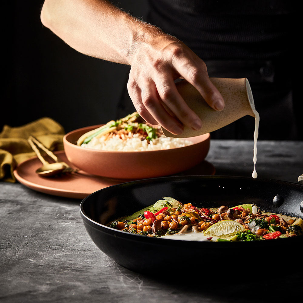 Culinarix ceramic frypan 30cm skillet with creamy green curry and vegetables beside rice - Baccarat