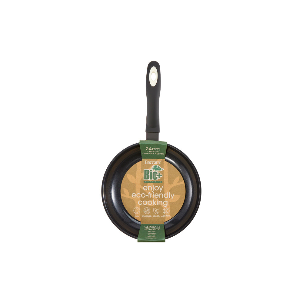 A creamy risotto with green peas in a white pan on a wooden board - cream bio frypan 20cm - Baccarat
