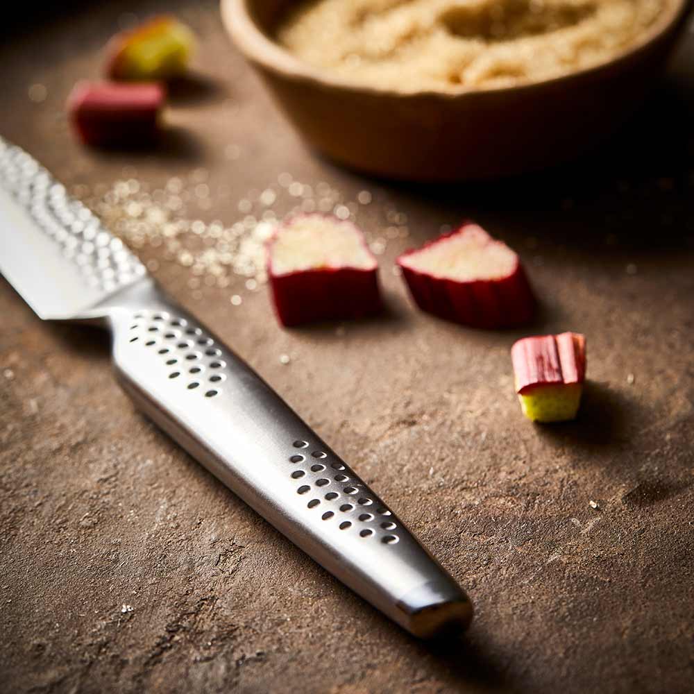 Textured blade knife on wood next to rhubarb chunks and brown sugar ceramic non stick - Stonex2