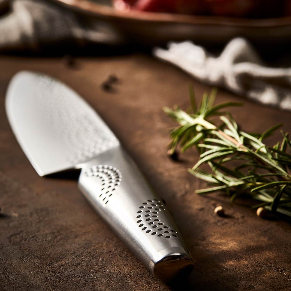 A silver chef's knife with textured blade and sleek handle - Baccarat id3 Samurai Utility Knife 11cm
