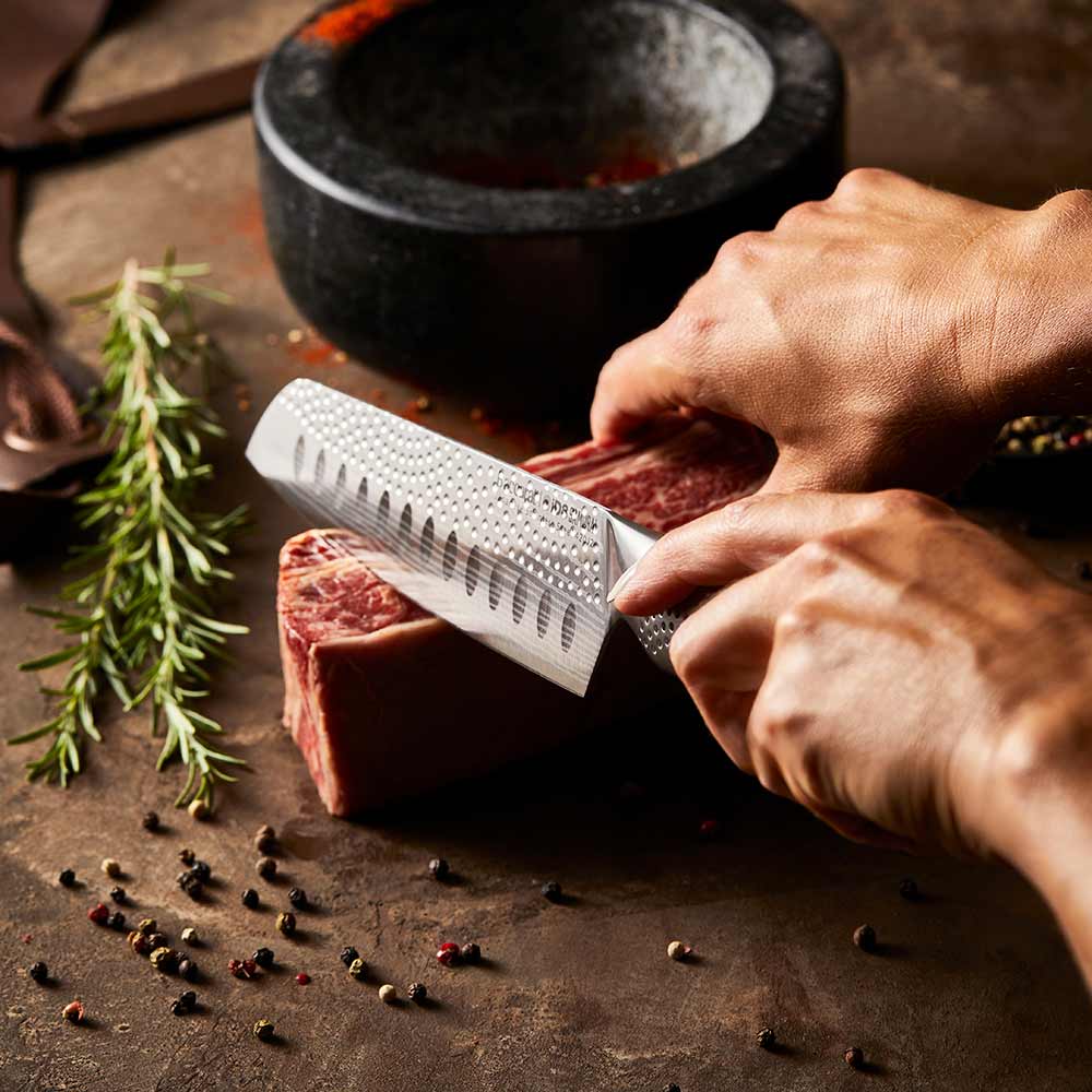 A sharp stainless steel kitchen knife on a white background featuring a silver blade 15cm - Baccarat