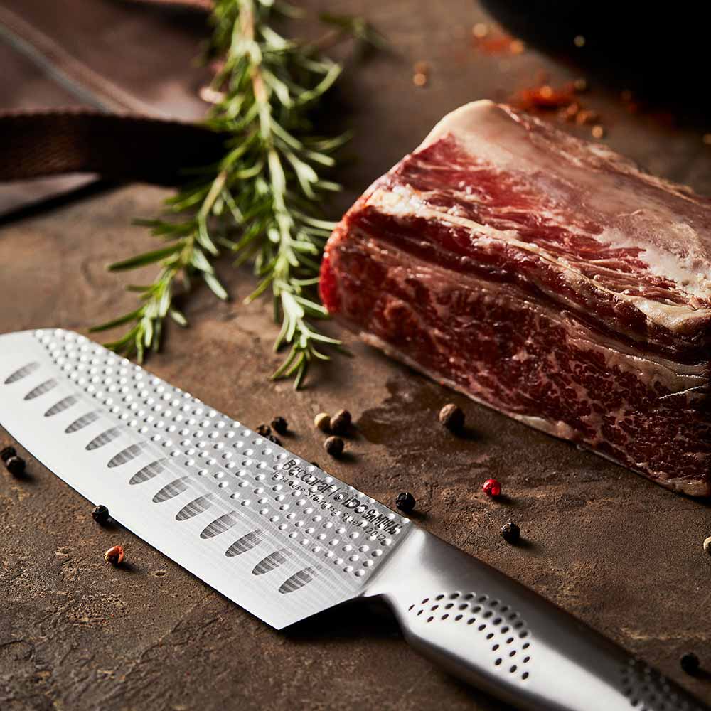 A sharp stainless steel kitchen knife on a white background featuring a silver blade 15cm - Baccarat