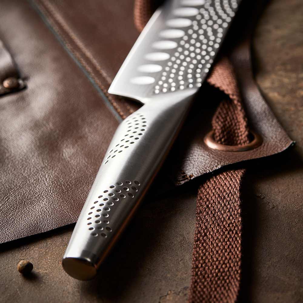 A sharp stainless steel kitchen knife on a white background featuring a silver blade 15cm - Baccarat