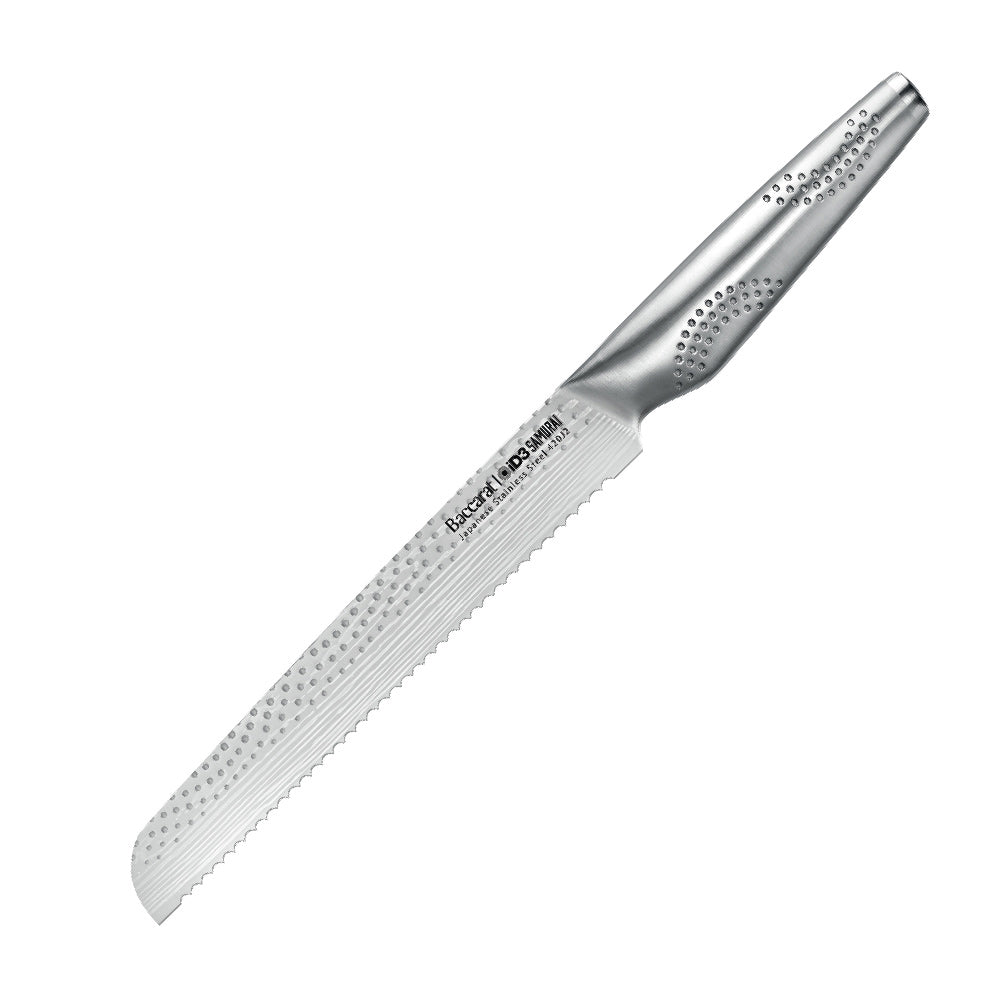 Close-up of serrated knife with sliced multigrain bread on wooden board silver knife 20cm - Baccarat