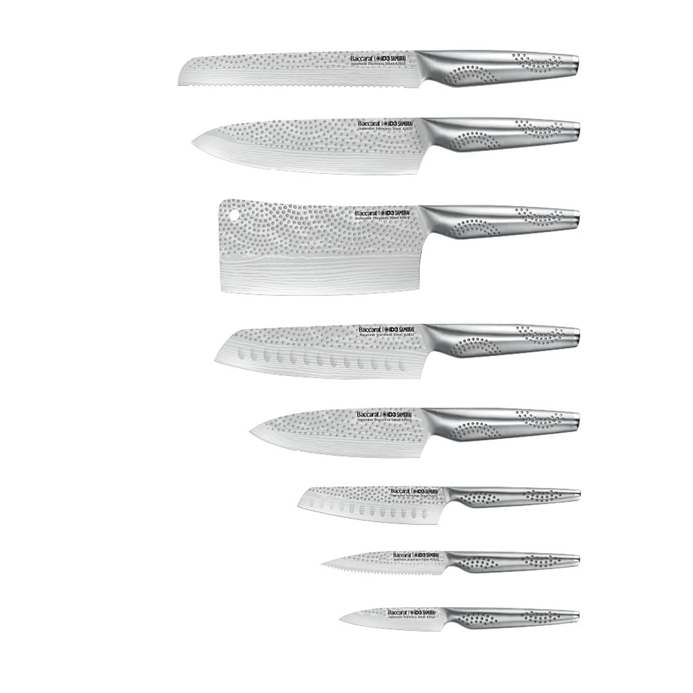 A set of fourteen sleek silver kitchen knives neatly arranged stainless steel knife block - Baccarat