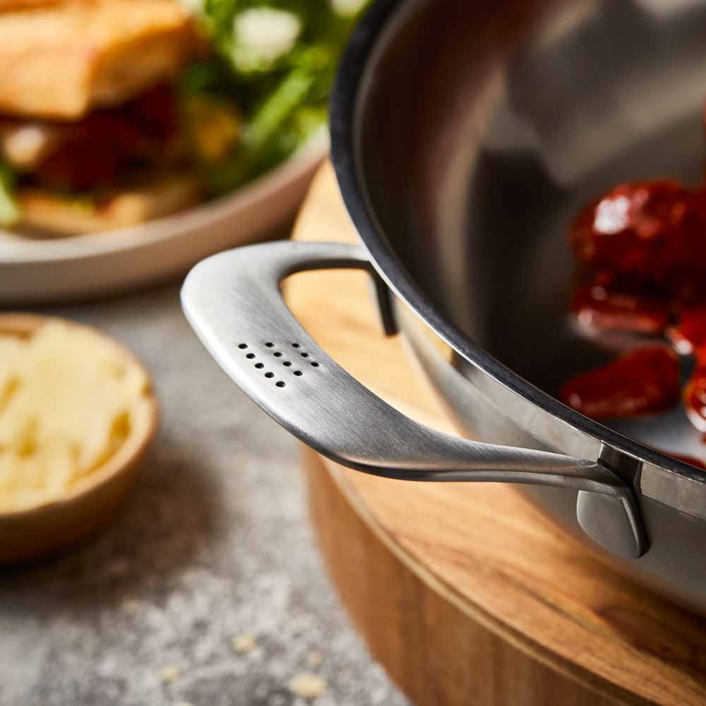 Meal setting with meatball sandwich beer and greens grey cookware 32cm saute pan with lid - Baccarat