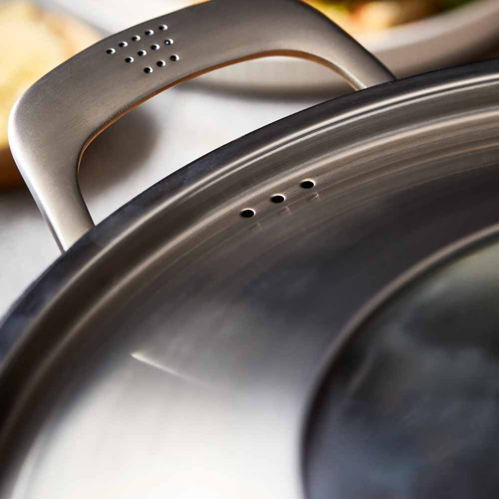 Meal setting with meatball sandwich beer and greens grey cookware 32cm saute pan with lid - Baccarat