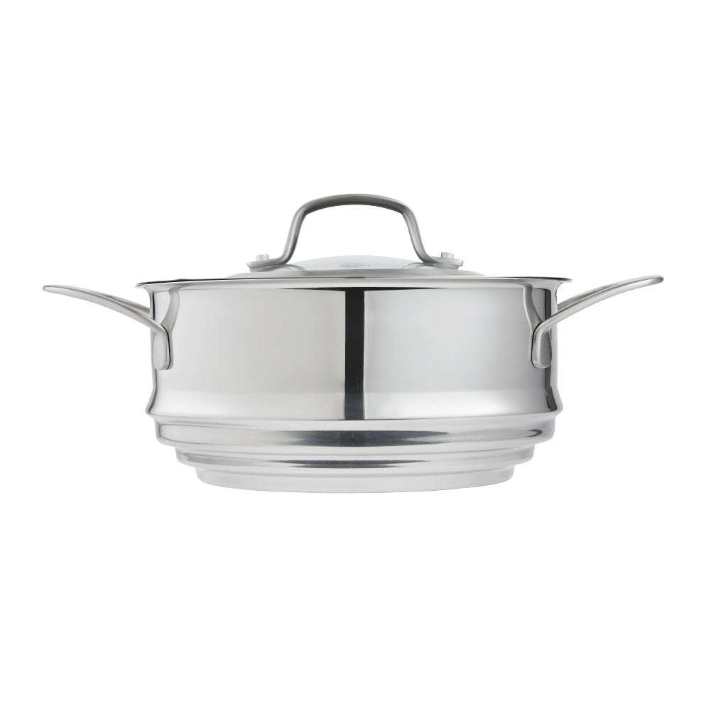 Hand lifting lid off stainless steel steamer with green vegetables on wooden board 32cm - Baccarat