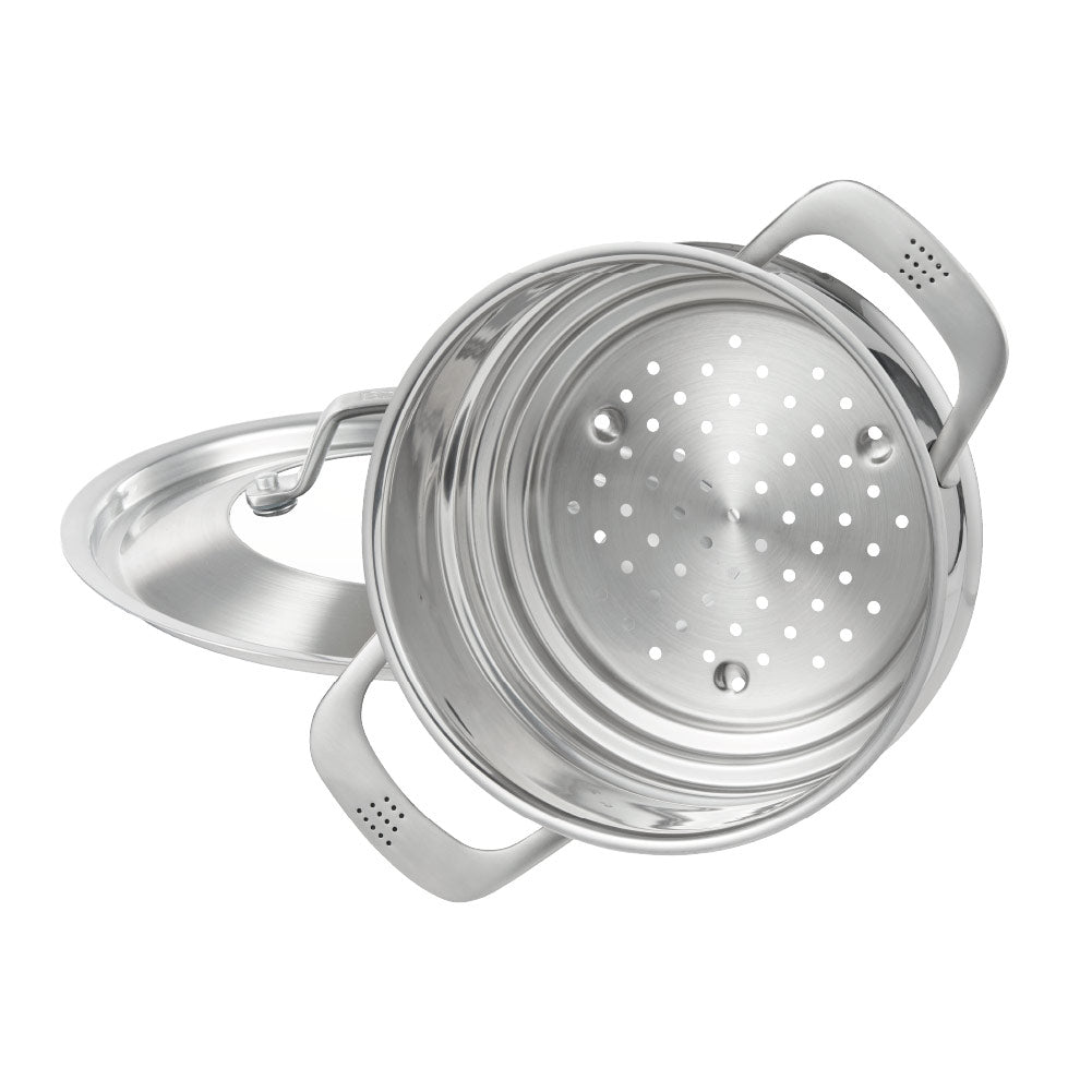 Hand lifting lid off stainless steel steamer with green vegetables on wooden board 32cm - Baccarat