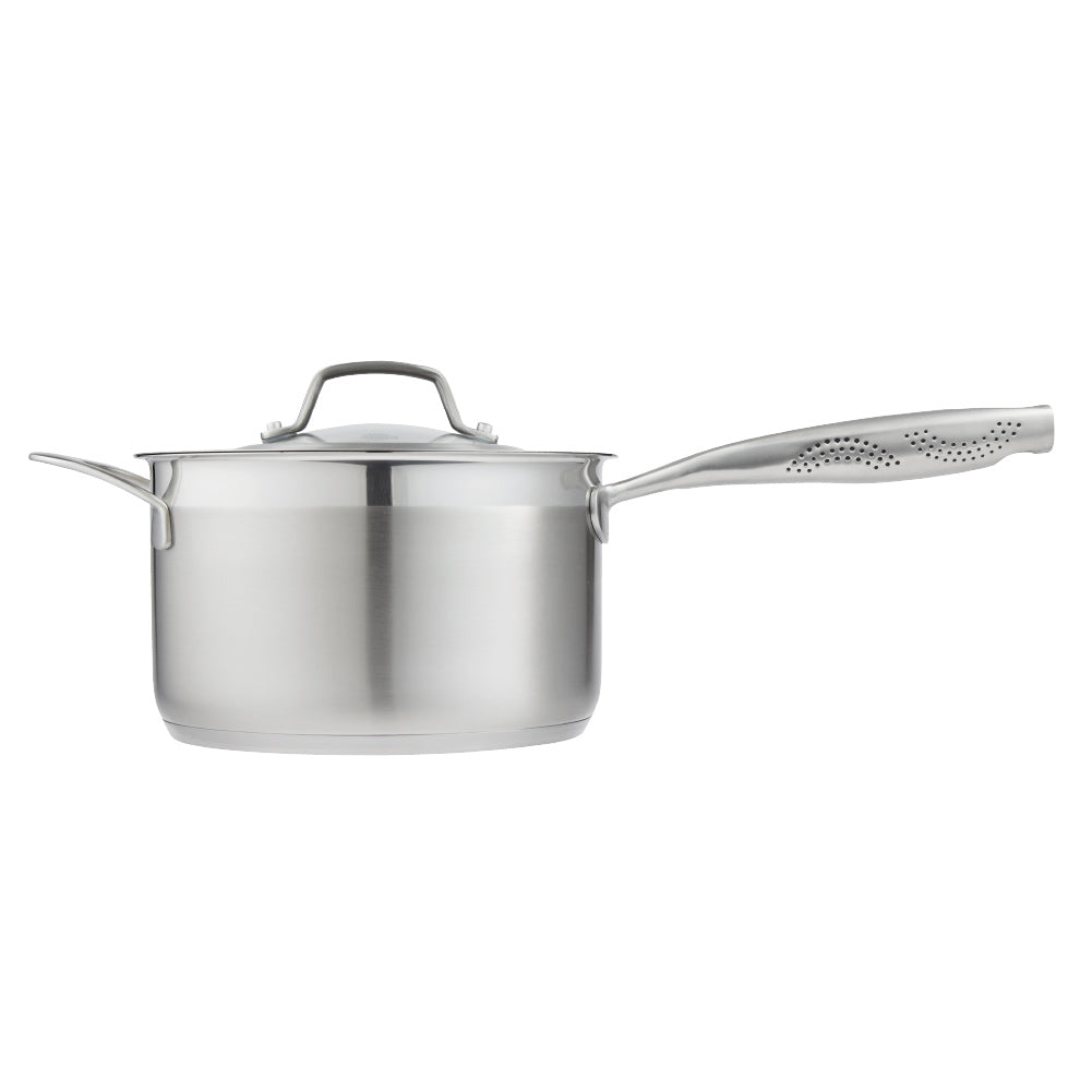 stainless steel saucepan 20cm pot of soup on a wooden board beside black bowl of noodles - Baccarat