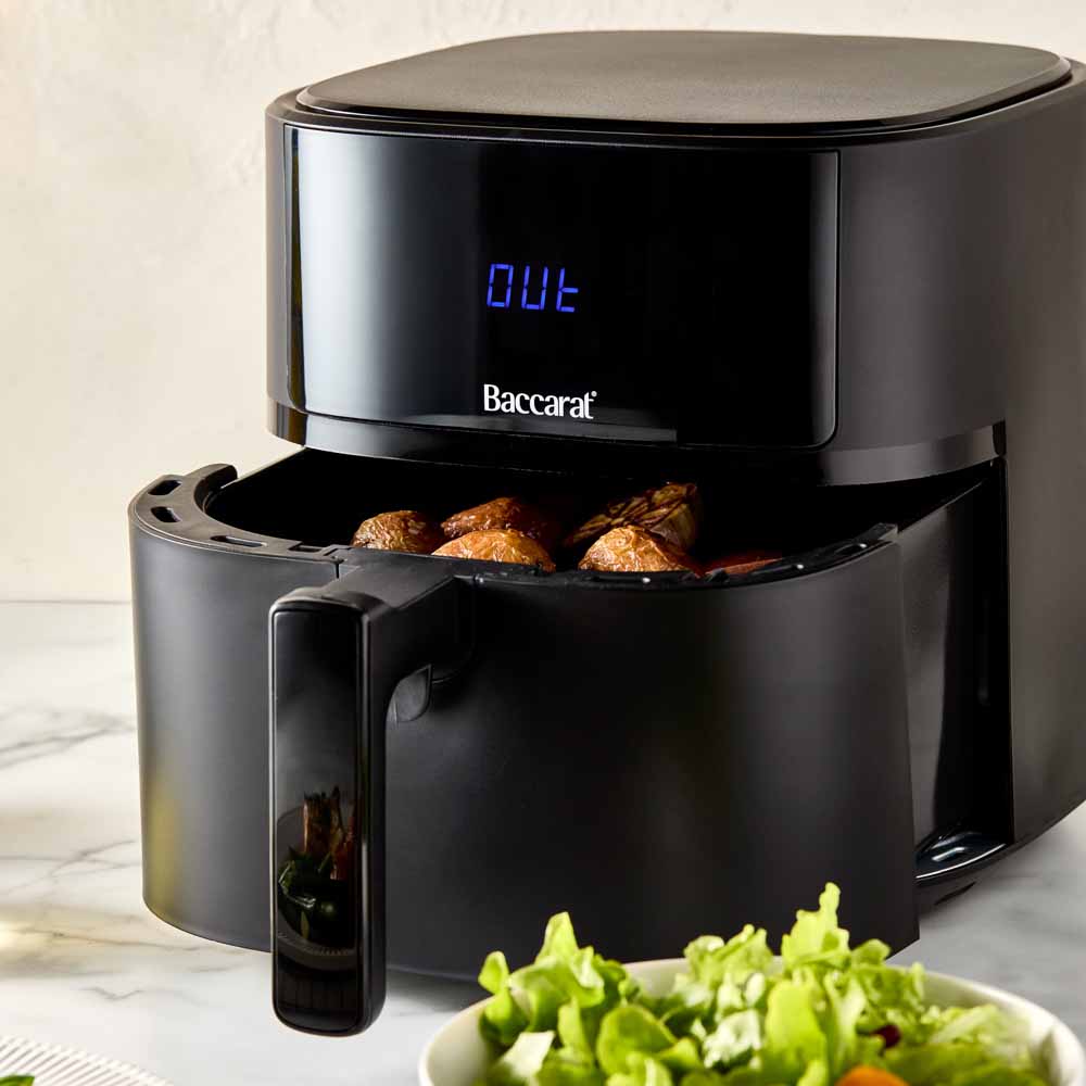 A black air fryer with digital display sits on a marble countertop - Baccarat Compact Air Fryer 5 7l