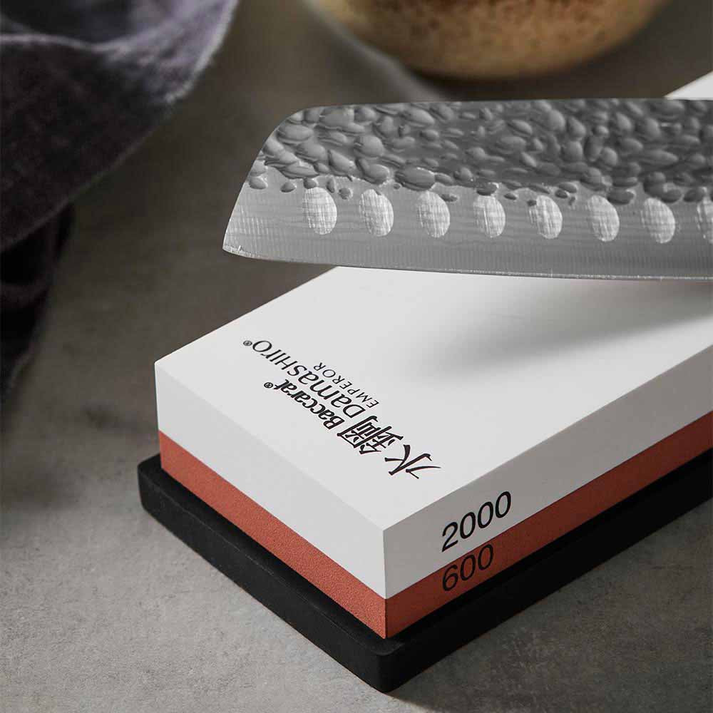 Close up of 600/2000 whetstone and santoku knife - Baccarat