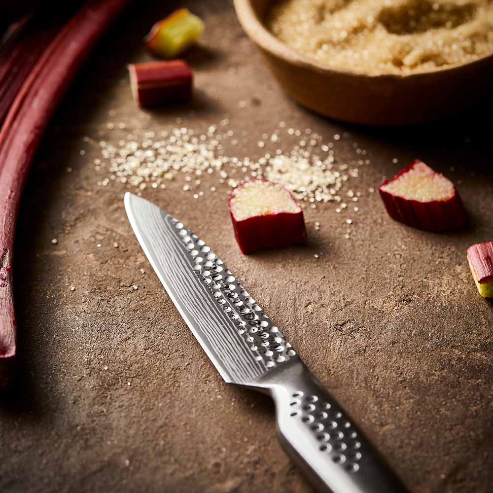 Textured blade knife on wood next to rhubarb chunks and brown sugar ceramic non stick - Stonex2
