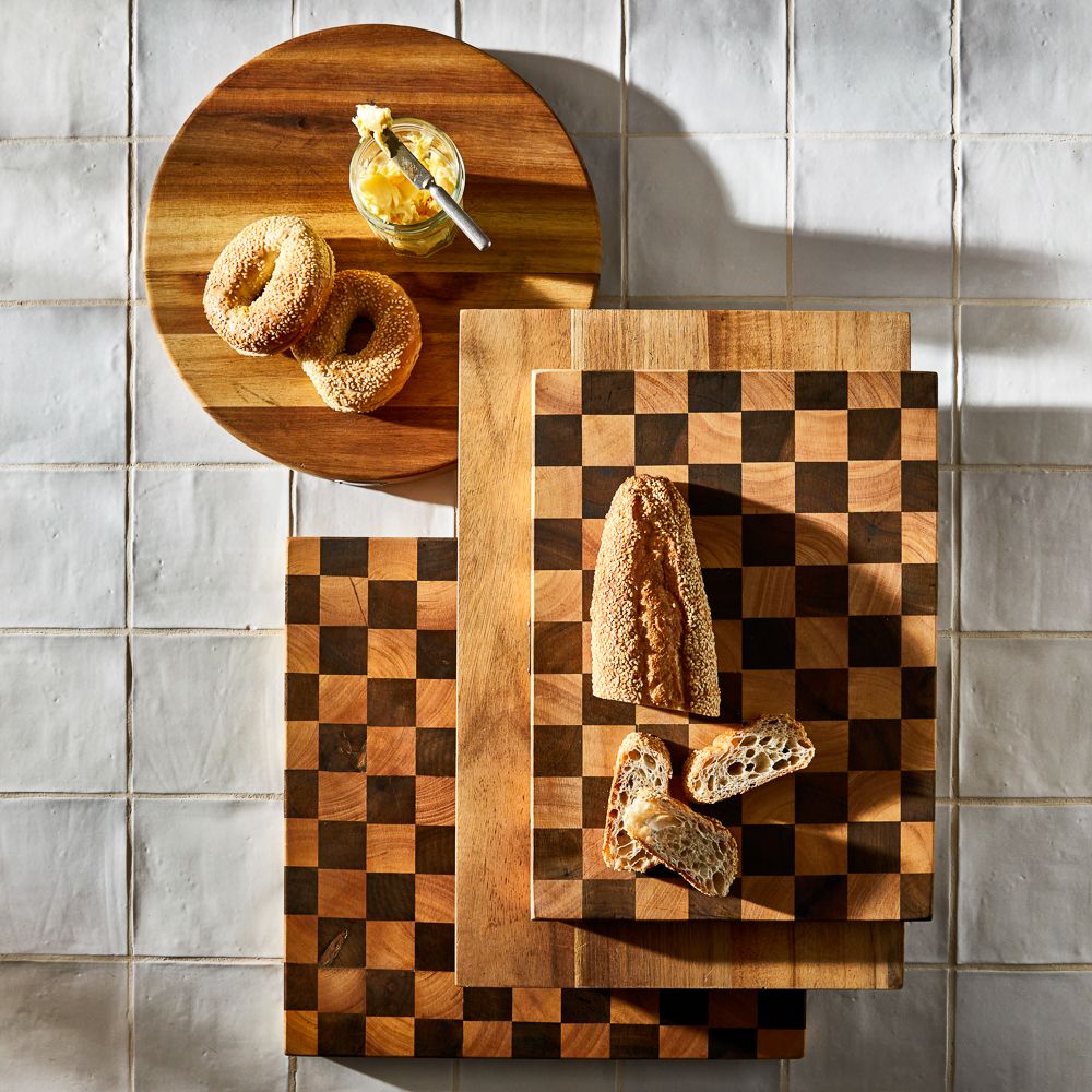 A rectangular wooden cutting board featuring natural grain in light brown - Baccarat Butchers Corner