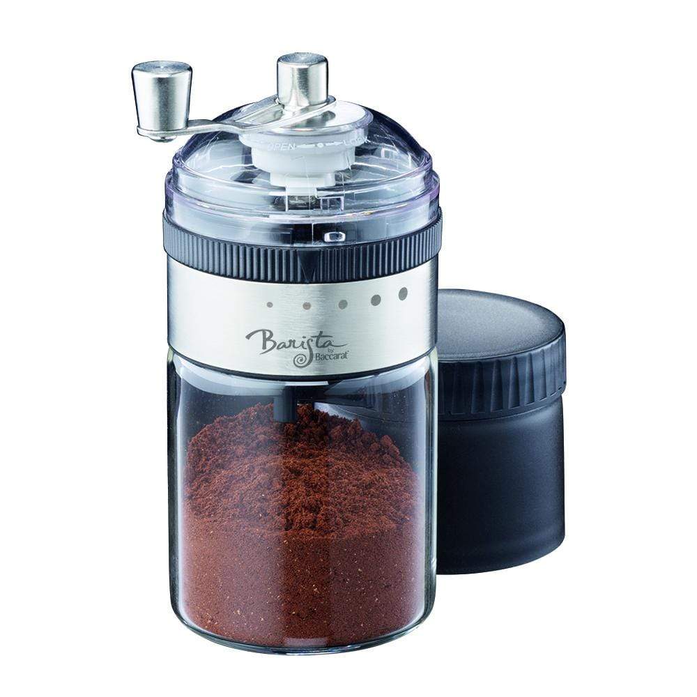 Elegant manual coffee grinder with a sleek transparent base filled with ground coffee - Baccarat