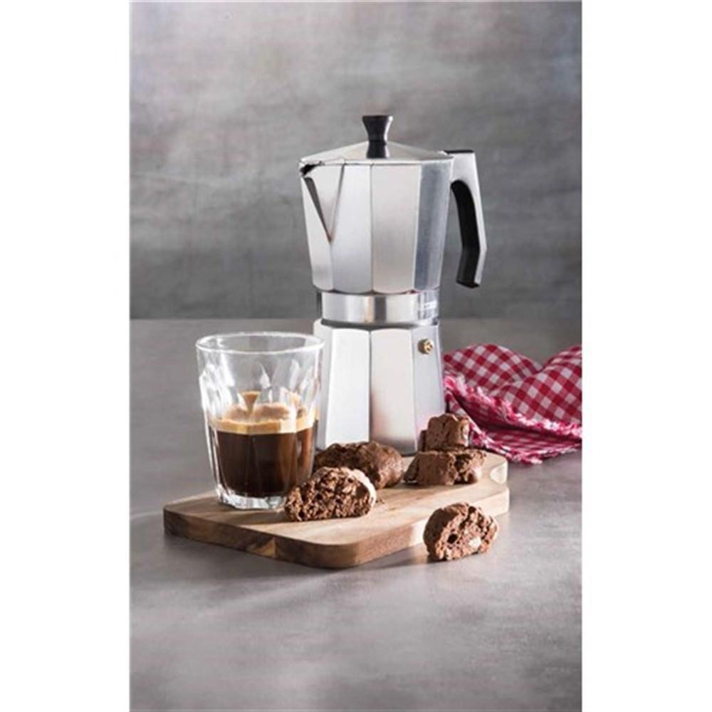 Espresso and biscotti arranged on a wooden board with moka pot and cloth - Baccarat barista italico