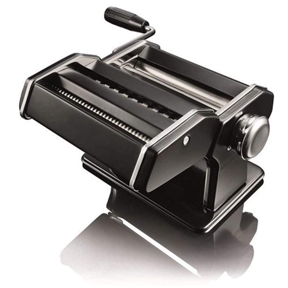 A person creating fresh golden pasta in a cozy kitchen - Baccarat gourmet 150mm pasta machine black