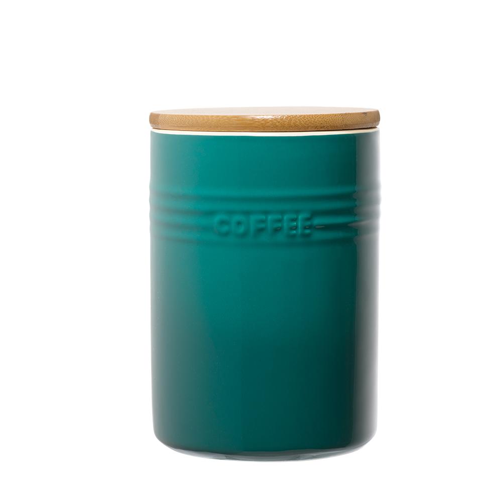 A stylish set of three cylindrical teal ceramic canisters with wooden lids - Baccarat
