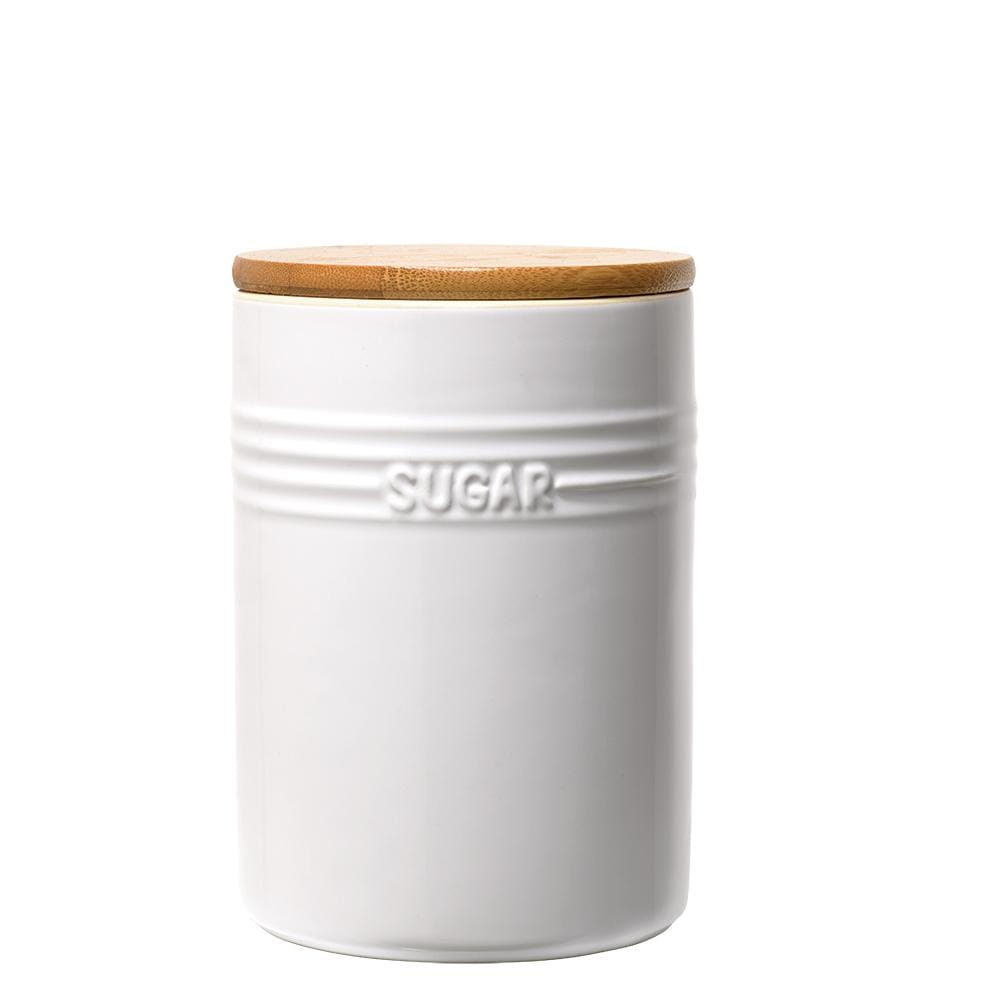 A set of three white ceramic canisters with elegant lids and a sleek design - Baccarat