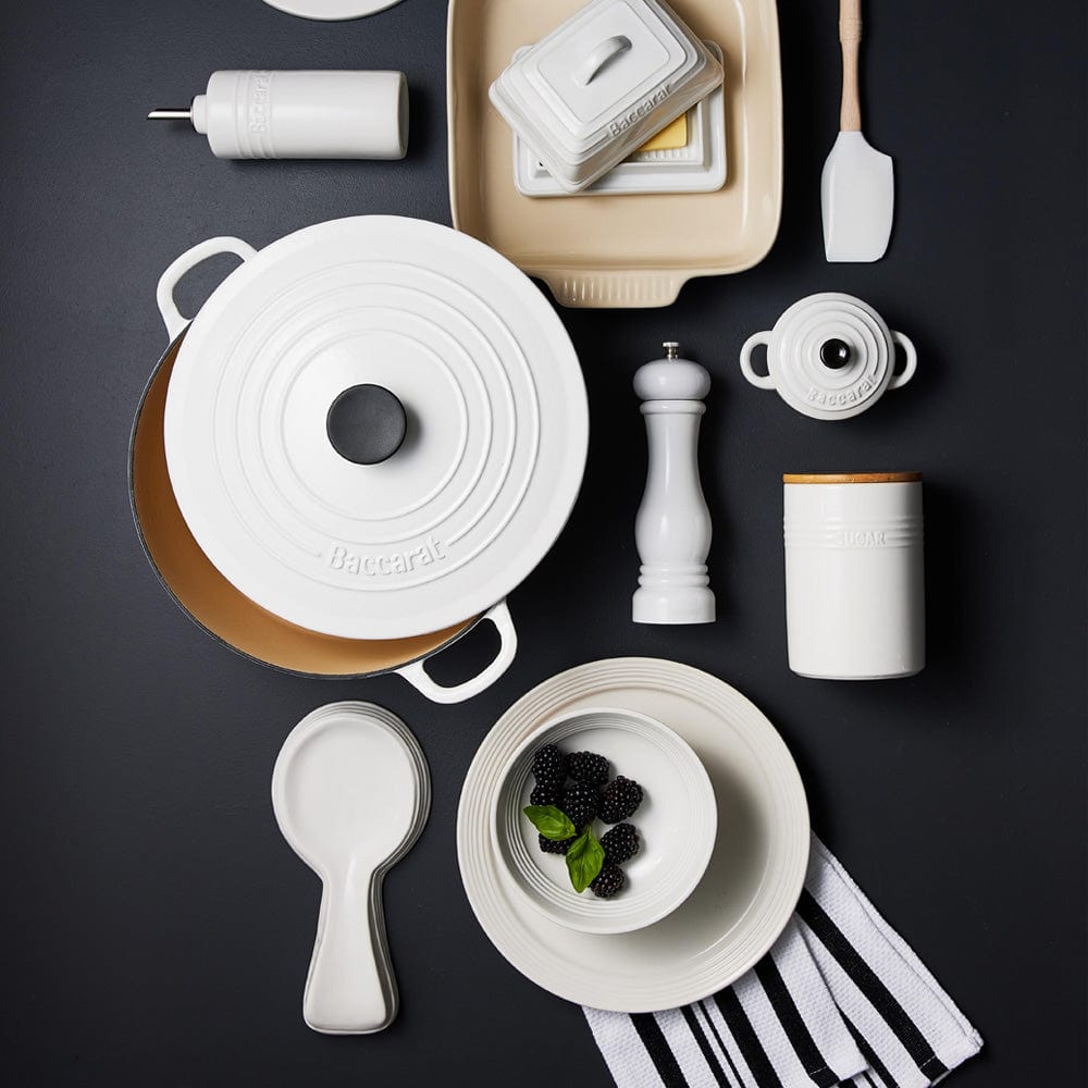 A set of three white ceramic canisters with elegant lids and a sleek design - Baccarat