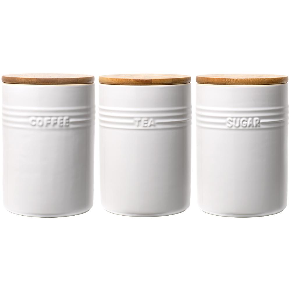 A set of three white ceramic canisters with elegant lids and a sleek design - Baccarat