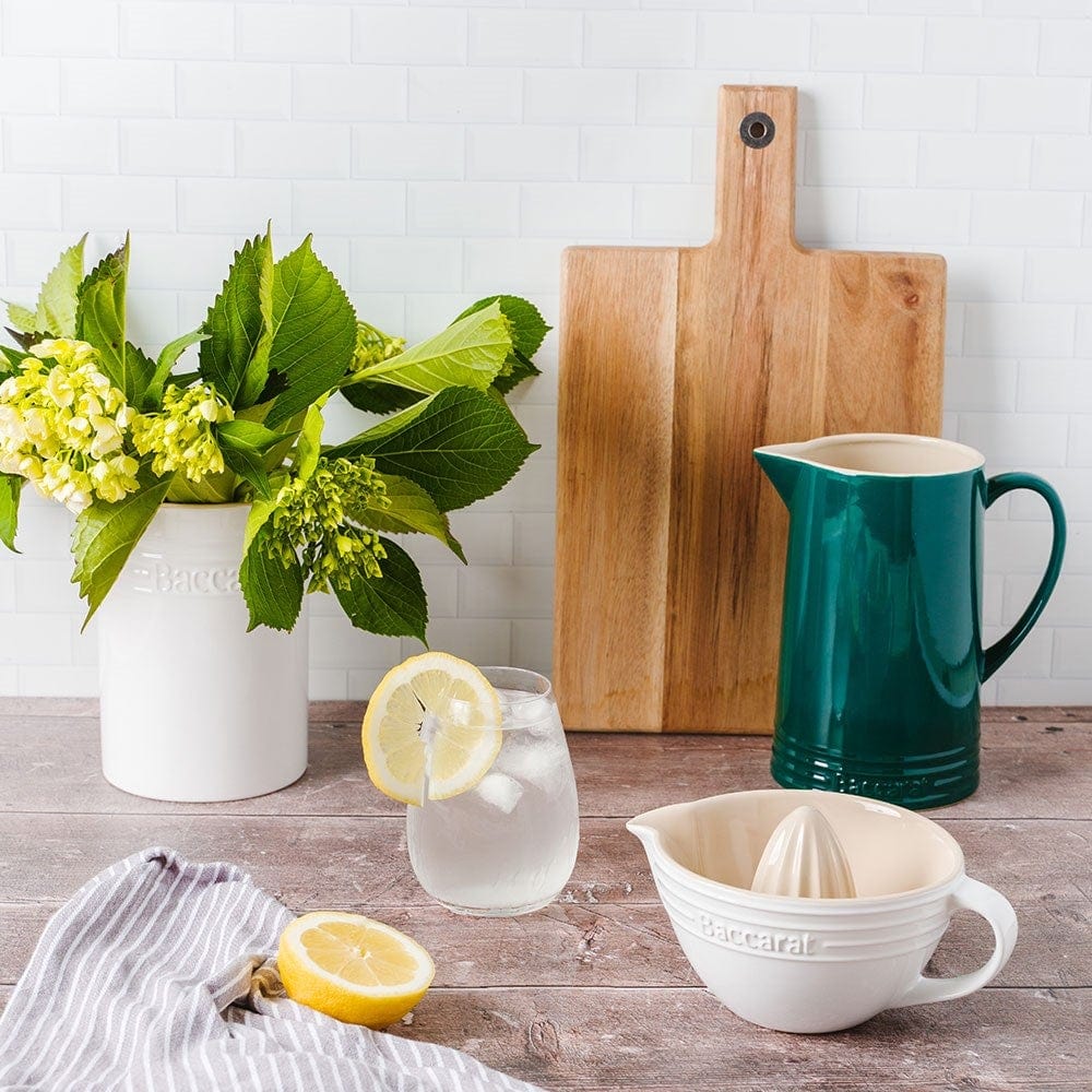 sleek white citrus juicer with spout and handle beside elegant packaging - Baccarat le connoisseur