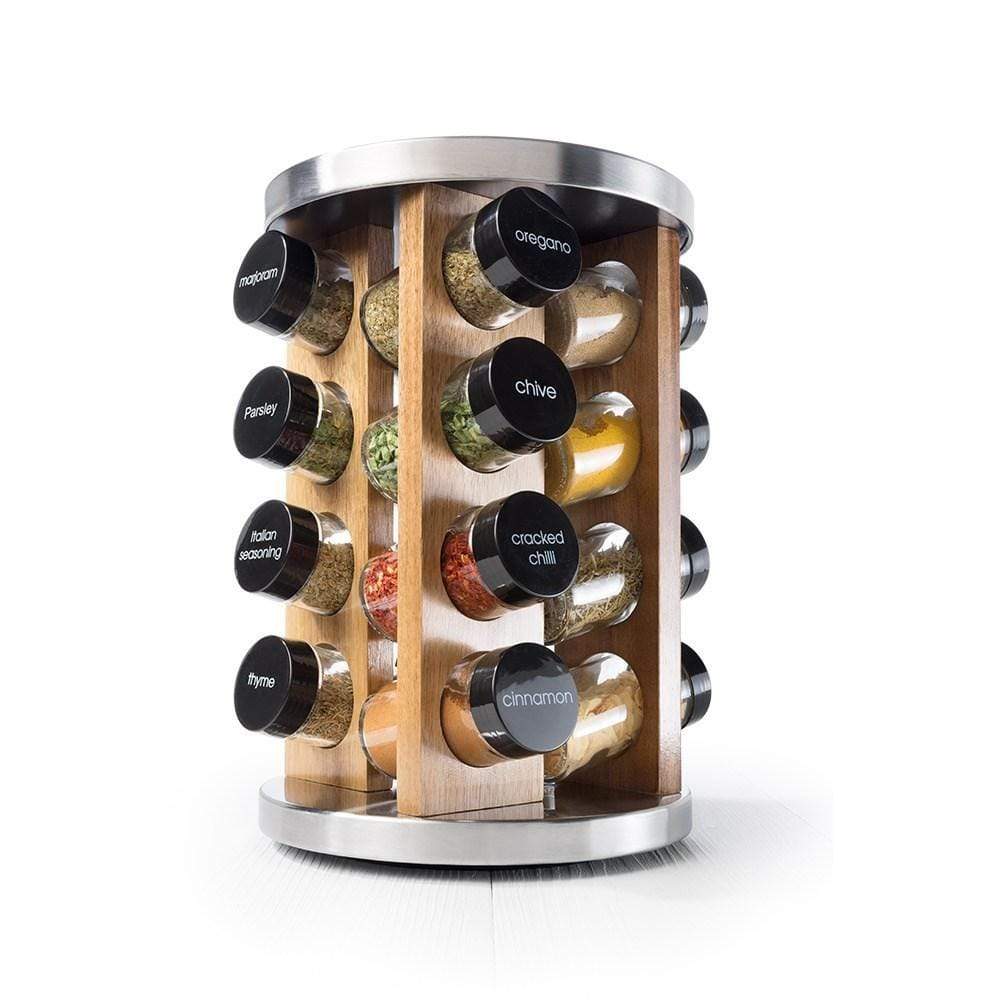 Stainless steel spice rack with 16 jars displaying vibrant spices on a kitchen countertop - Baccarat