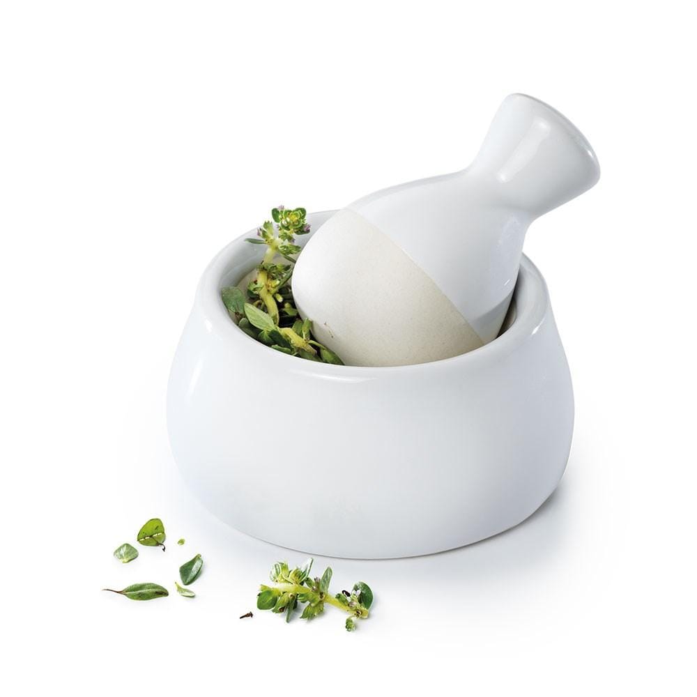 Mini mortar and pestle set in white ceramic with green herbs - Baccarat Spice Market