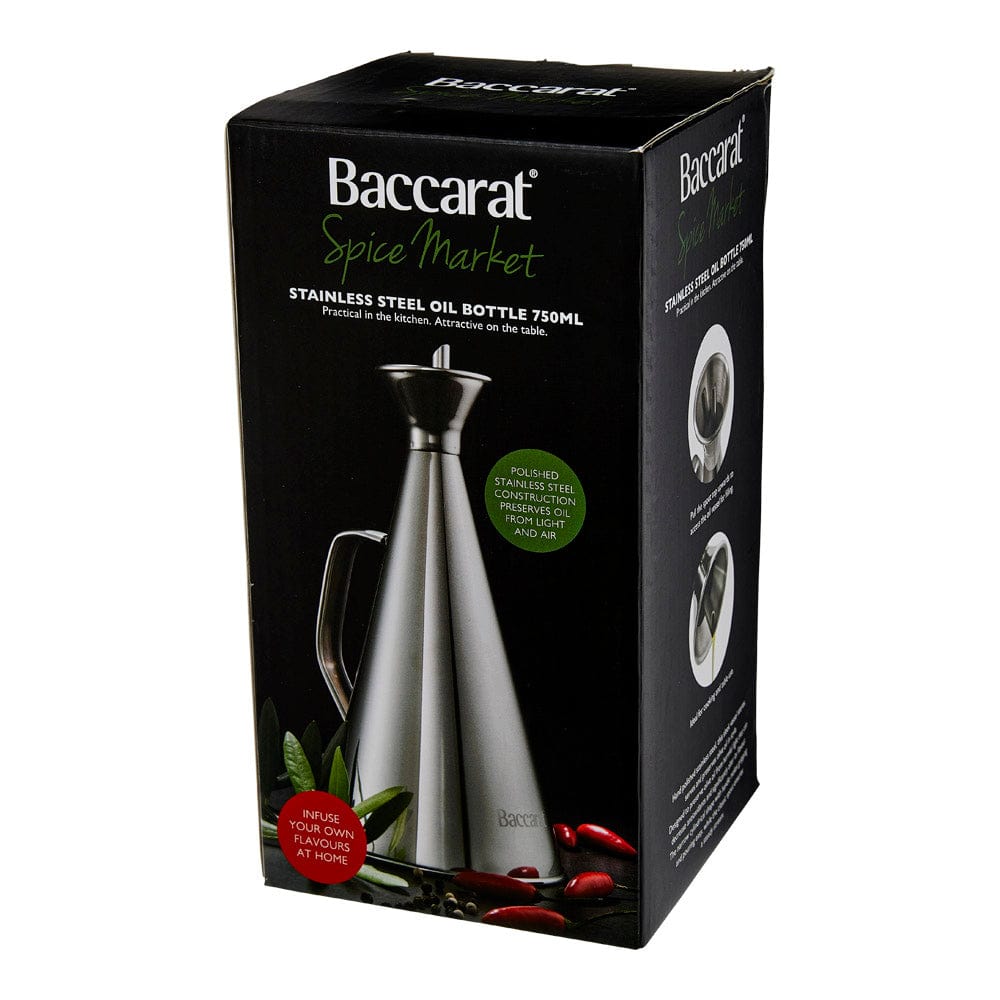 A polished stainless steel oil bottle elegantly drizzling golden olive oil - Baccarat spice market