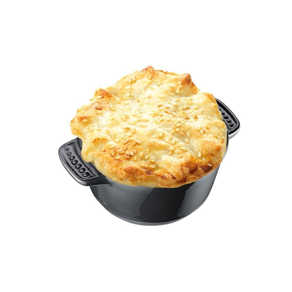 a deliciously baked chicken pie in a mini casserole vibrant purple background - Baccarat stone