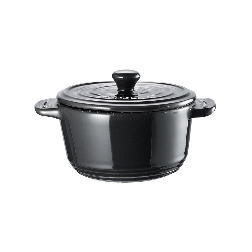 a deliciously baked chicken pie in a mini casserole vibrant purple background - Baccarat stone