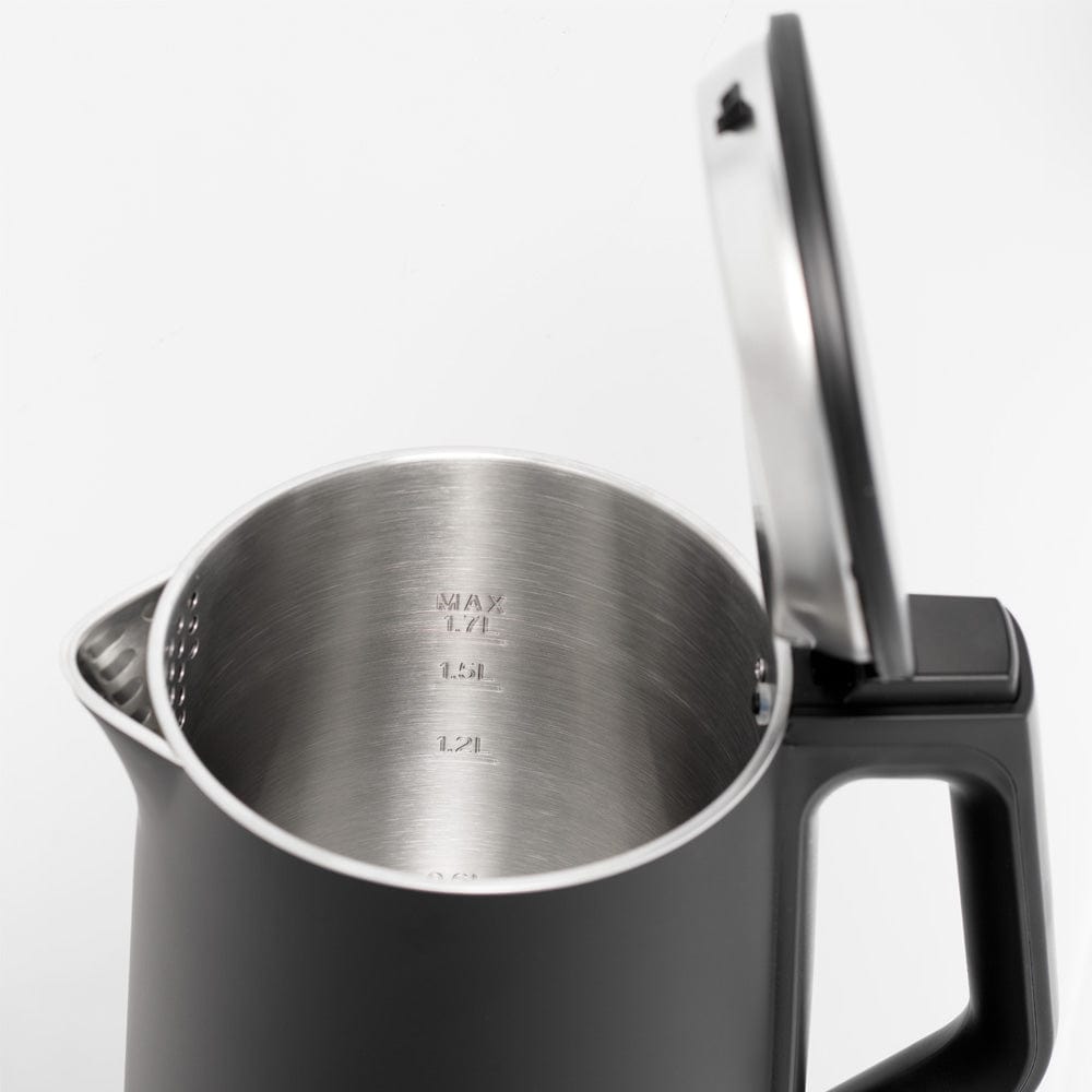 electric kettle on kitchen counter with cup saucer and plate of toast black kettle - Baccarat