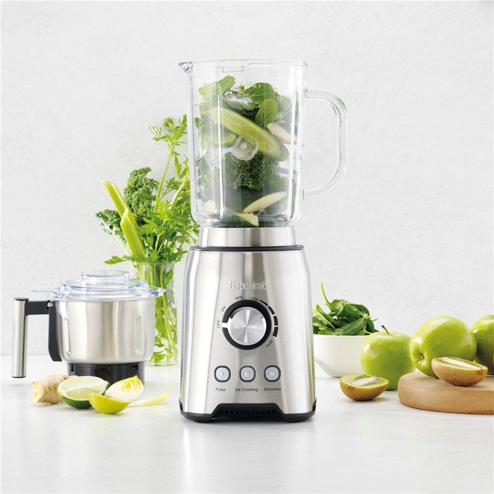 A vibrant countertop filled with fresh vegetables, produce and a powerful blender grinder - Baccarat