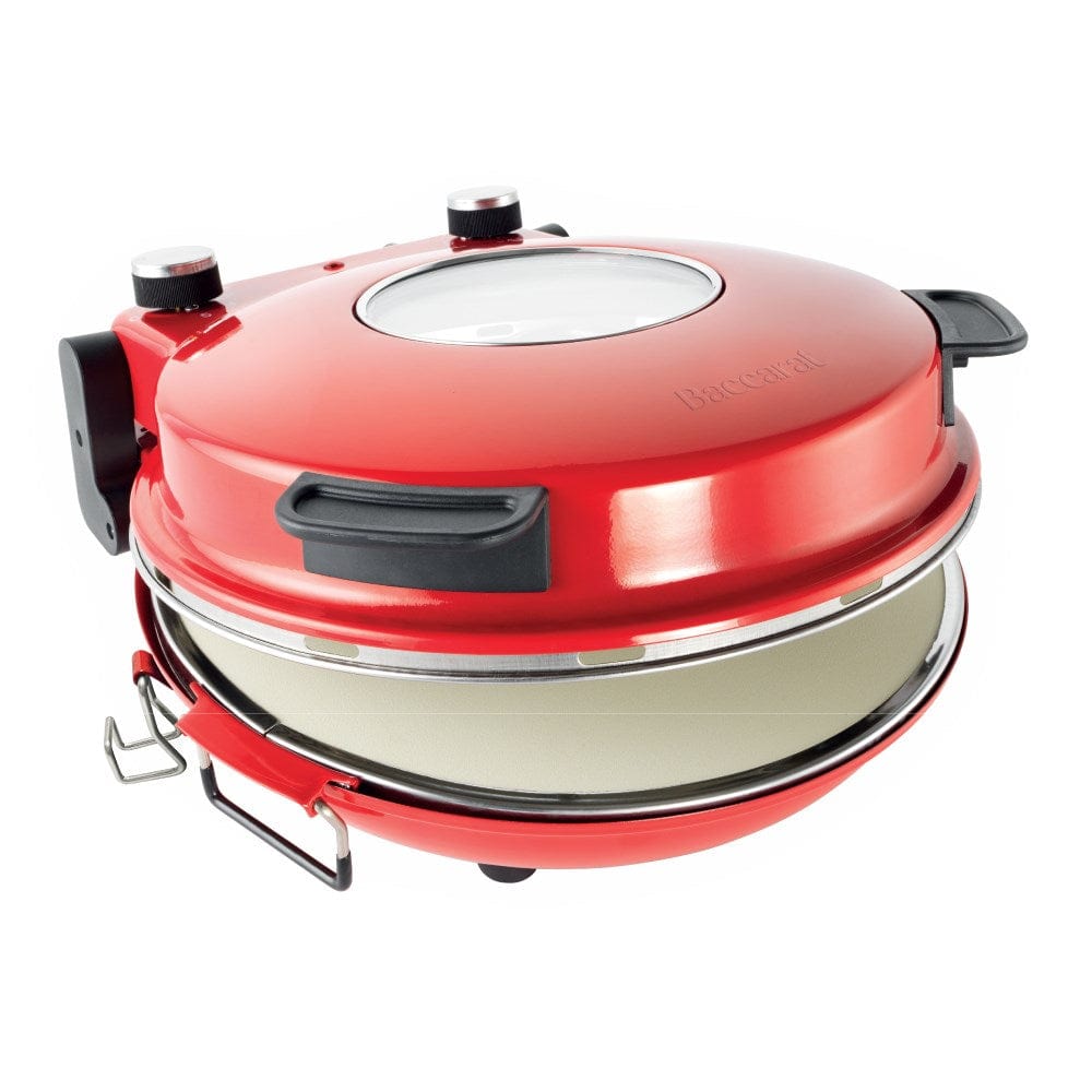 Red gourmet slice pizza oven with temperature dial beside a plant and tomato sauce bottle - Baccarat