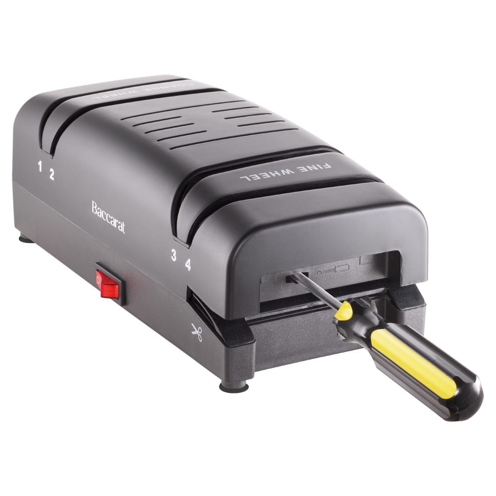 Electric knife sharpener on kitchen counter next to sliced mangoes black knife sharpener - Baccarat