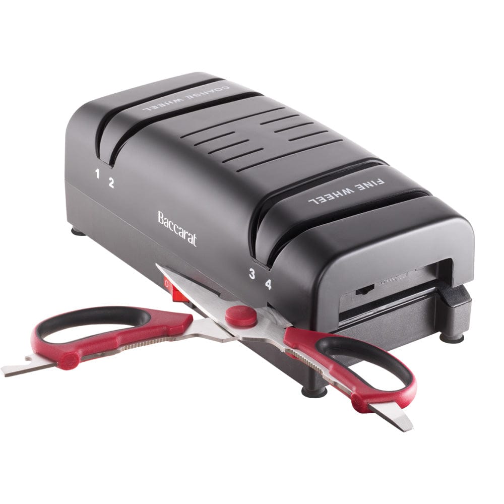 Electric knife sharpener on kitchen counter next to sliced mangoes black knife sharpener - Baccarat