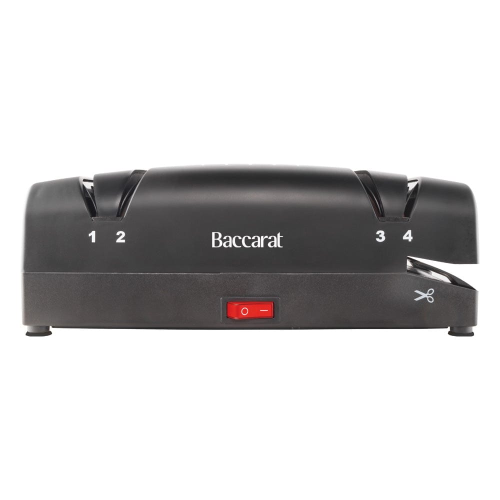 Electric knife sharpener on kitchen counter next to sliced mangoes black knife sharpener - Baccarat