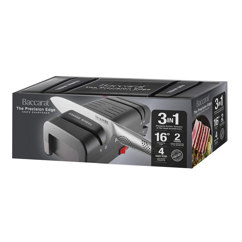 Electric knife sharpener on kitchen counter next to sliced mangoes black knife sharpener - Baccarat