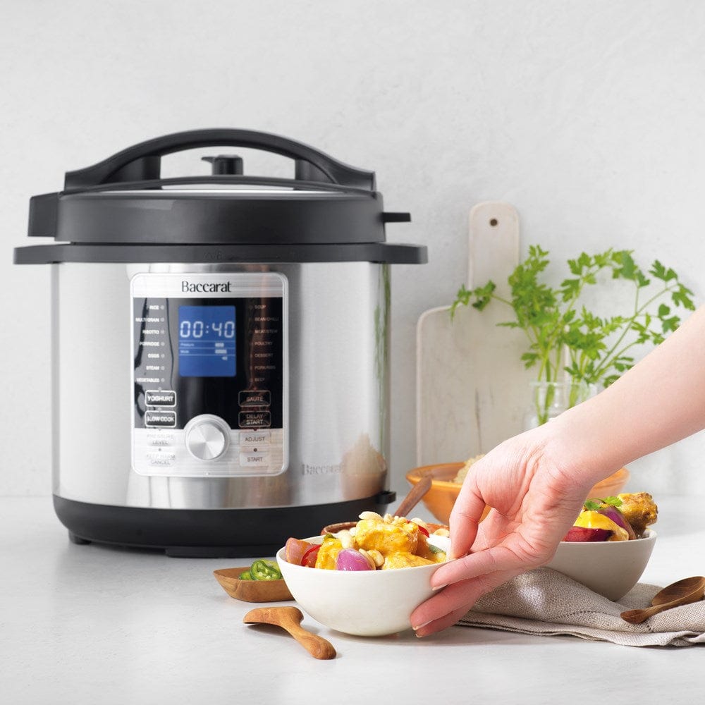 Aerial view of open black lid and stainless steel body - stew in a digital multicooker - Baccarat