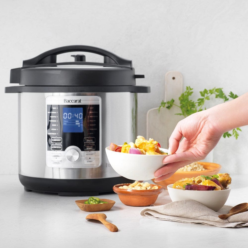 Aerial view of open black lid and stainless steel body - stew in a digital multicooker - Baccarat