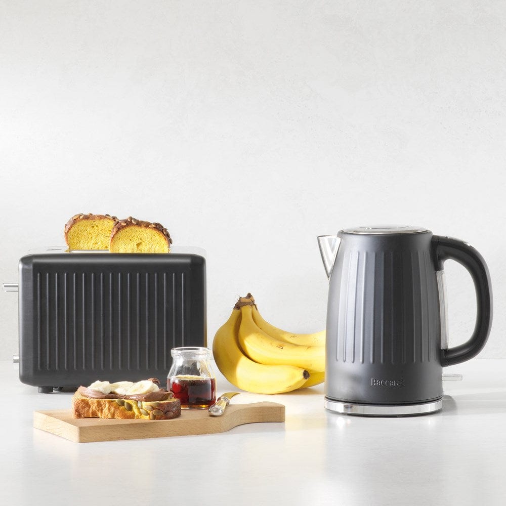 sleek black toaster surrounded by fresh bread and vibrant green avocados - Baccarat the toasty slice